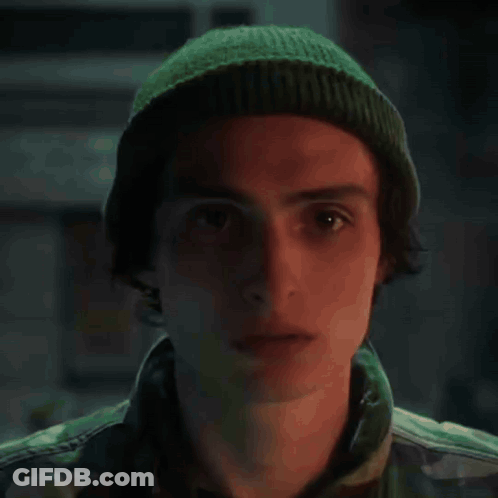 A Painting Of A Soldier Wearing A Helmet And Looking At The Camera GIF