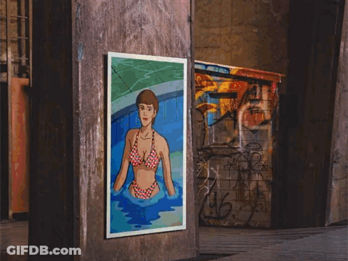 A Painting Of A Woman In A Bikini Is Hanging On A Pillar GIF