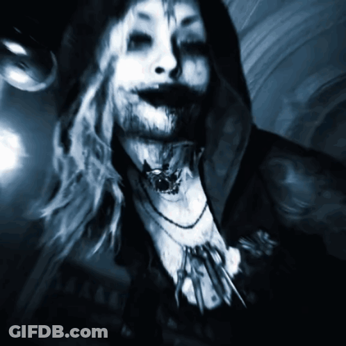 A Painting Of A Woman With A Necklace Around Her Neck And A Hood GIF