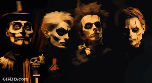 A Painting Of Four Skeletons With Skulls On Their Faces GIF