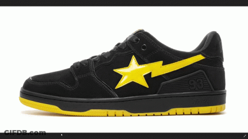 A Pair Of Black And Yellow Bape Shoes GIF