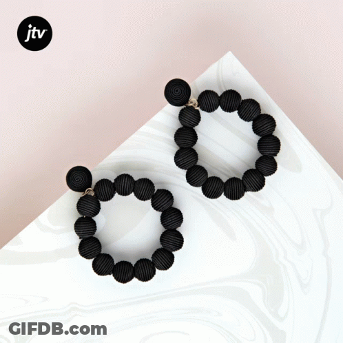 A Pair Of Black Beaded Hoop Earrings With A Jtv Logo GIF