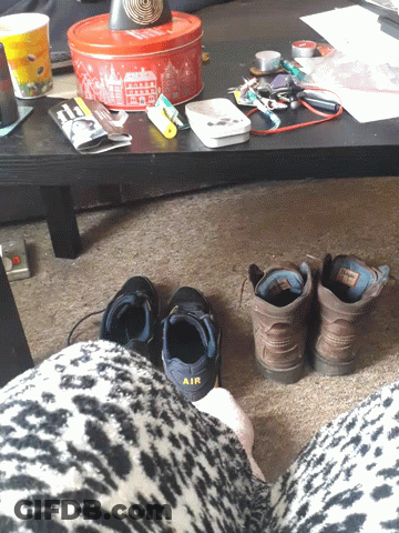 A Pair Of Black Shoes With The Word Air On Them GIF