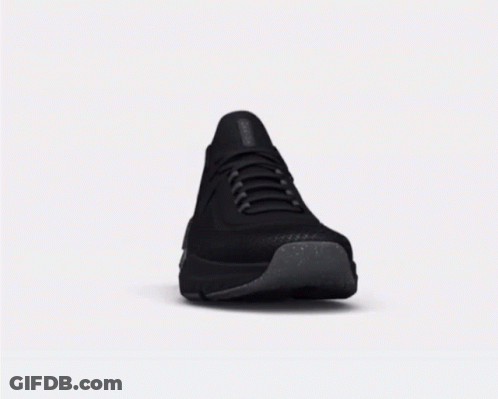 A Pair Of Black Sneakers With A Gray Sole GIF