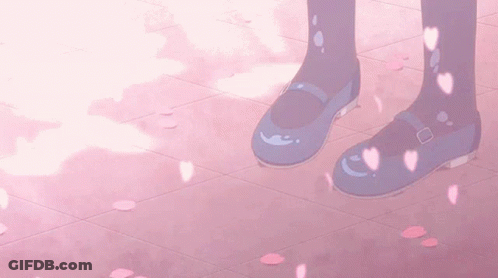 A Pair Of Blue Shoes On A Pink Tile Floor With Petals Falling From The Sky GIF