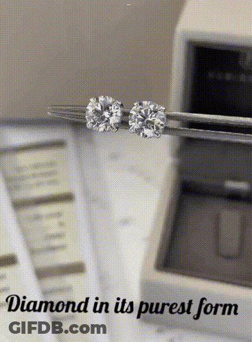 A Pair Of Diamond Stud Earrings Being Held In Tweezers With The Words " Diamond In Its Purest Form " Below Them GIF