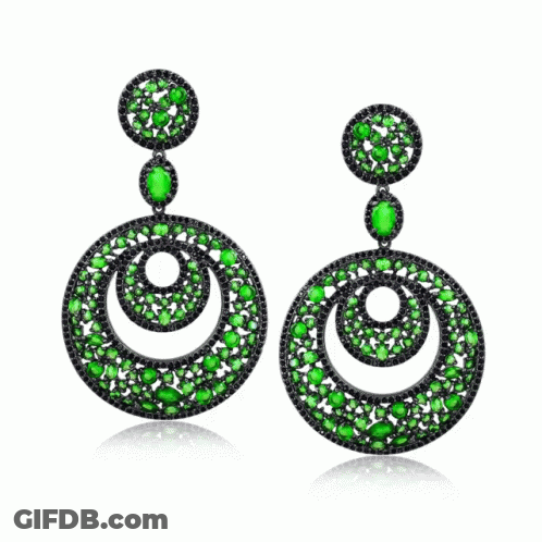 A Pair Of Earrings With Green And Black Stones On A White Background GIF