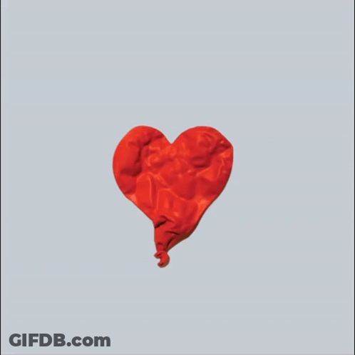 A Pair Of Hands Holding A Red Heart Shaped Object GIF