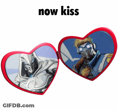 A Pair Of Heart Shaped Glasses With A Picture Of A Man And The Words Now Kiss GIF