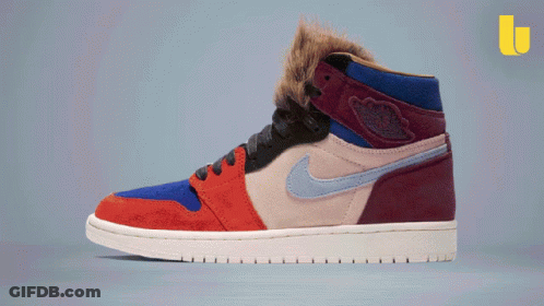 A Pair Of Nike Air Jordans With A Furry Collar GIF