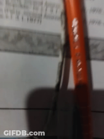 A Pair Of Pliers Is Laying On A Piece Of Paper With A Ruler In The Background GIF