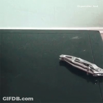 A Pair Of Pliers Laying On A Black Surface With A Caption That Says Ig Punisher_izrd GIF