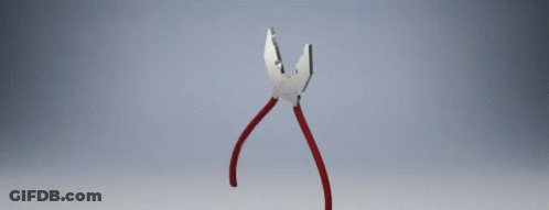 A Pair Of Pliers With Red Handles On A Gray Surface GIF