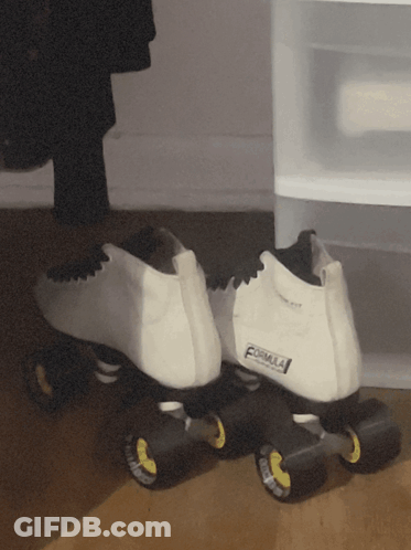 A Pair Of White Roller Skates That Say Formula On The Back GIF