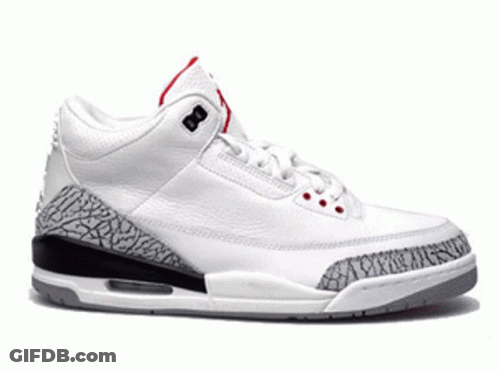 A Pair Of Yellow And Black Nike Air Jordan Shoes GIF