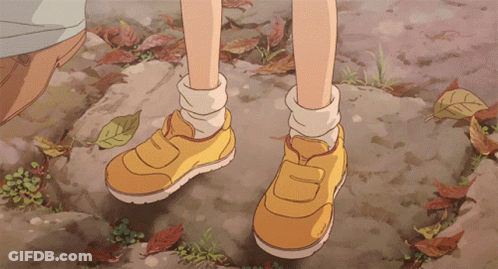 A Pair Of Yellow Shoes With The Letter D On The Side GIF