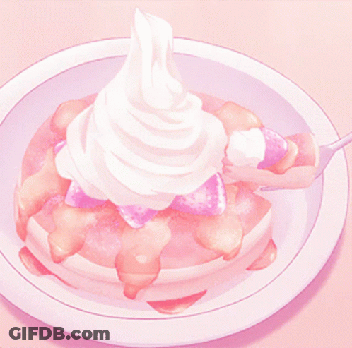 A Pancake With Strawberries And Whipped Cream On Top GIF