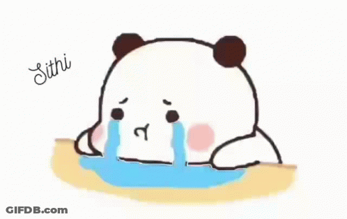 A Panda Bear Is Crying While Sitting On A Table And Tears Are Coming Out Of Its Eyes . GIF