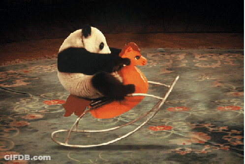 A Panda Bear Is Riding A Rocking Horse GIF