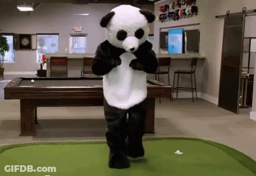 A Panda Bear Mascot Is Standing On A Green Putting Green In Front Of A Pool Table GIF