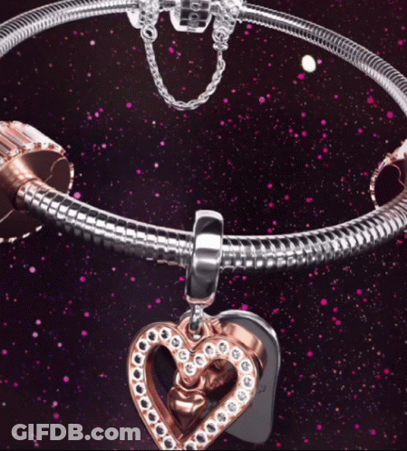 A Pandora Bracelet With A Heart Charm On It GIF
