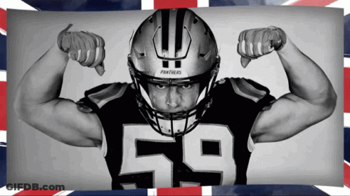 A Panthers Football Player Flexes His Muscles GIF