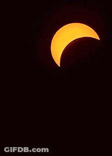 A Partial Eclipse Of The Sun Is Visible In The Night Sky GIF