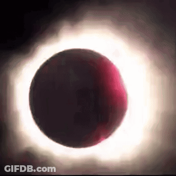 A Partial Eclipse Of The Sun With A Red Ring Around The Moon GIF