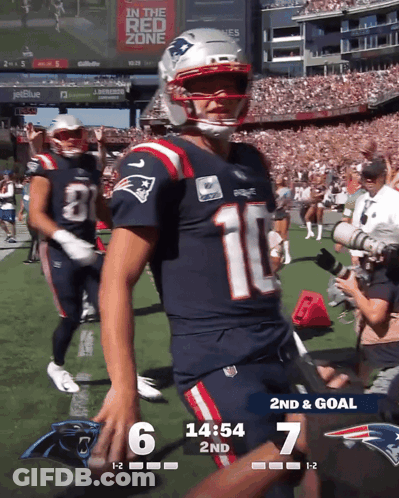 A Patriots Football Player Stands On The Field During A Game GIF