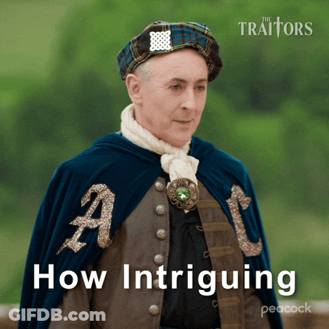 A Peacock Ad For The Traitors Shows A Man In A Cape GIF