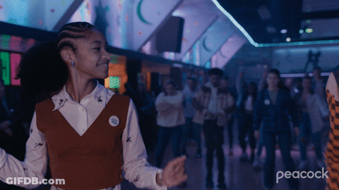 A Peacock Ad Shows A Girl Dancing In A Club GIF