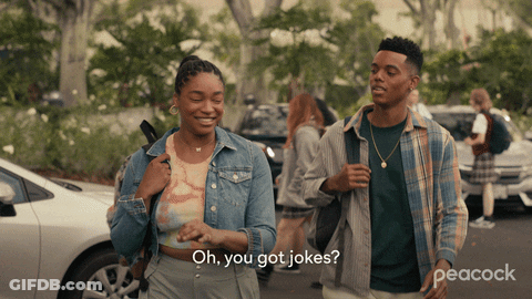 A Peacock Ad Shows A Man And A Woman Walking Down A Street GIF