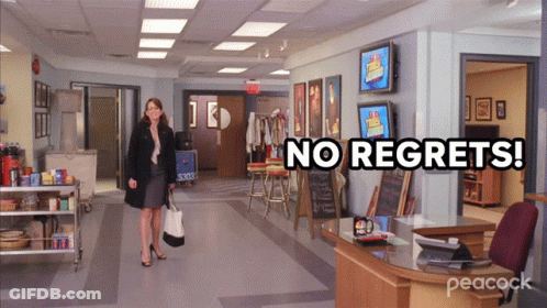 A Peacock Ad Shows A Woman Walking Through An Office GIF