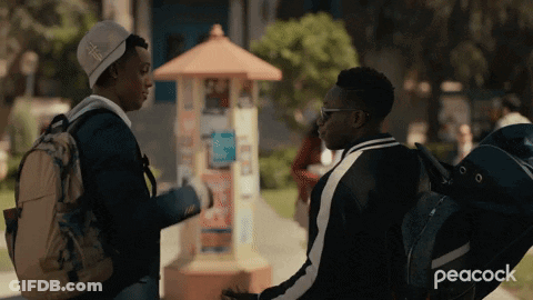 A Peacock Ad Shows Two Young Men Talking GIF