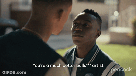 A Peacock Advertisement With Two Men Talking To Each Other GIF