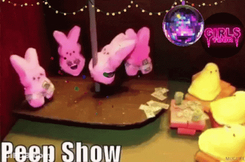 A Peep Show Is Being Advertised With A Disco Ball In The Background GIF