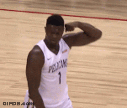 A Pelican Basketball Player Is Flexing His Muscles On The Court GIF
