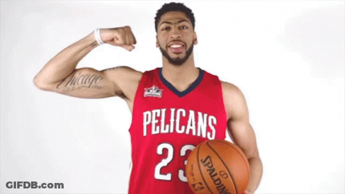 A Pelican 'S Basketball Player Flexes His Muscles While Holding A Spalding Basketball GIF