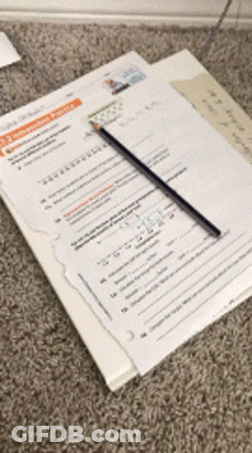 A Pencil Is Sitting On Top Of A Piece Of Paper That Says ' A ' On It GIF
