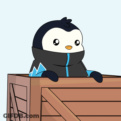 A Penguin In A Black And Blue Jacket Is Peeking Out Of A Wooden Box GIF