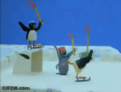 A Penguin Is Holding A Hockey Stick While Another Penguin Is On A Sled . GIF