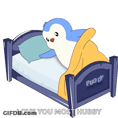 A Penguin Is Laying In A Bed That Says Puddy Penguins On It GIF
