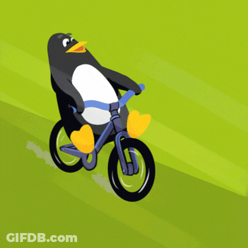 A Penguin Is Riding A Bike On A Grassy Field GIF