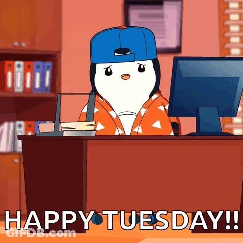 A Penguin Is Sitting At A Desk In Front Of A Computer With The Words Happy Tuesday Written On The Bottom GIF