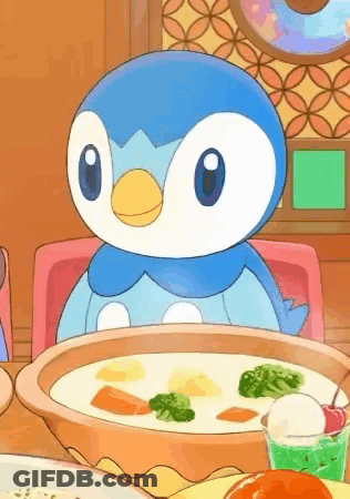 A Penguin Is Sitting At A Table With A Bowl Of Soup And A Cup Of Ice Cream . GIF