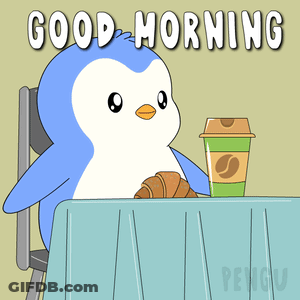 A Penguin Is Sitting At A Table With A Cup Of Coffee And A Croissant GIF