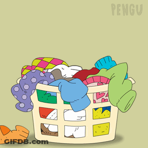 A Penguin Is Sitting In A Laundry Basket GIF