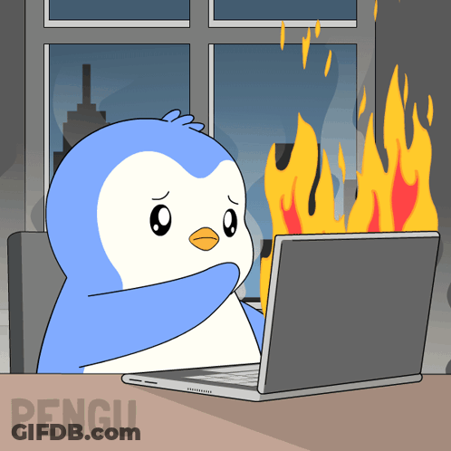 A Penguin Is Sitting In Front Of A Laptop With Flames Coming Out Of The Screen GIF
