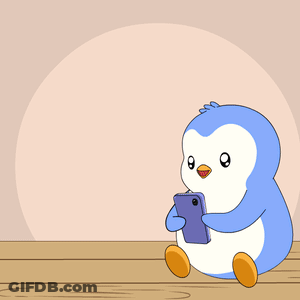 A Penguin Is Sitting On A Table Looking At A Cell Phone With Hearts Coming Out Of It GIF