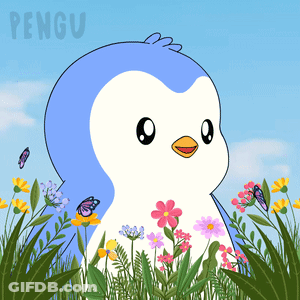 A Penguin Is Standing In A Field Of Flowers GIF